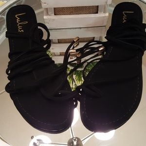 Black brand new LuLu wrap flat sandals